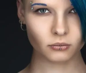young woman with facial piercings